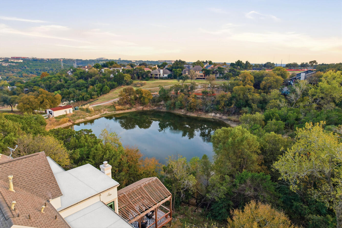Drone view over lake and neighborhood